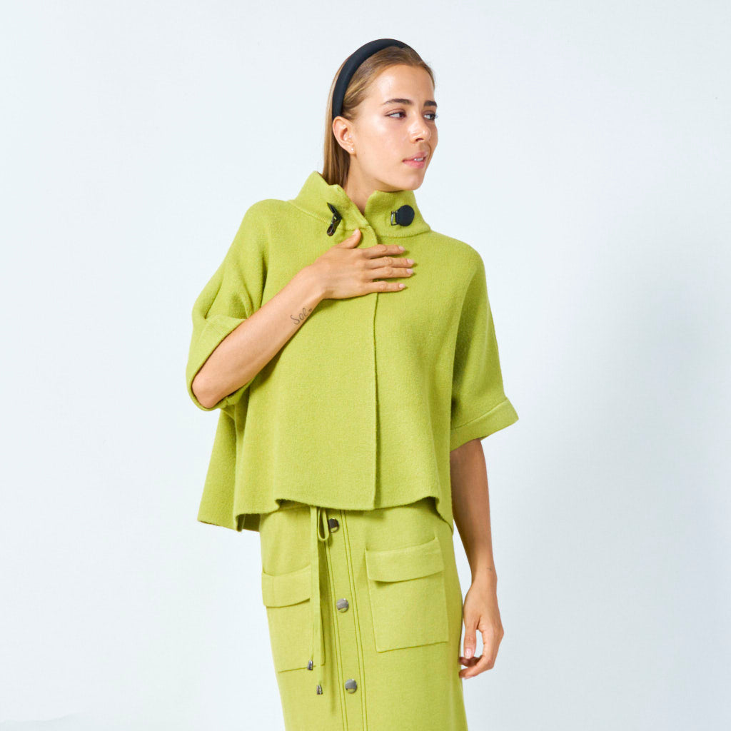 Elegant cape with buckle detail